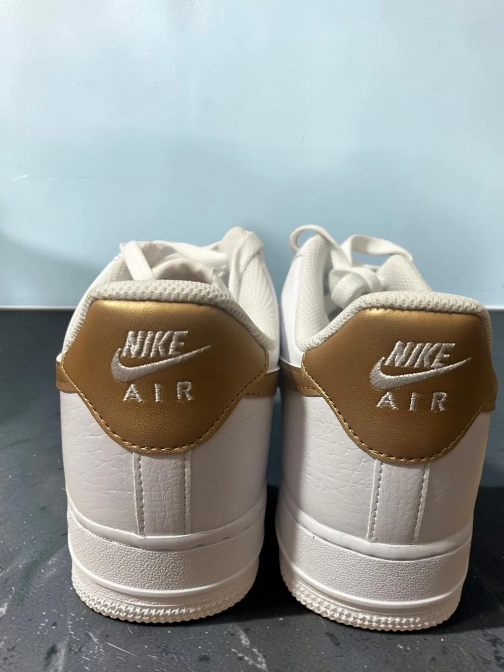 Nike Leather Low-Top Sneaker - White with Gold Swoosh